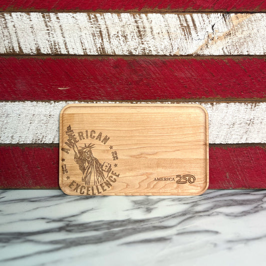 Wooden card with 'American Excellence' and Statue of Liberty engraving on a wooden background