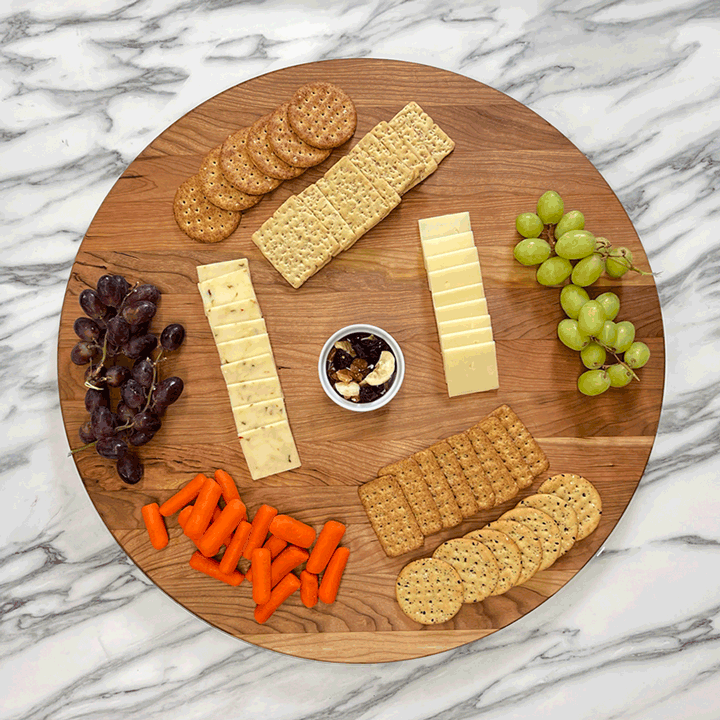 GIF Cherry Lazy Susan spinning with cheese, crackers, and grapes on it.