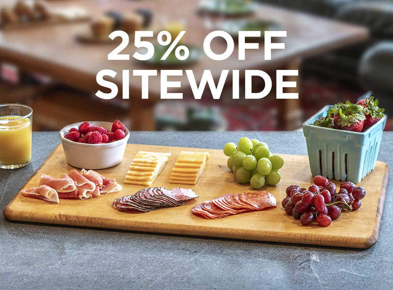 Wooden cutting board with meats, cheeses, and fruits on a table with '25% OFF SITEWIDE' text overlay.
