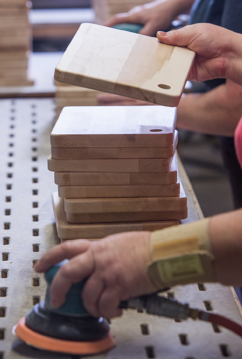 person holding a cutting board