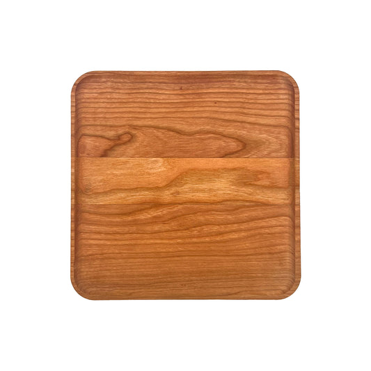 Wooden cutting board on a white background