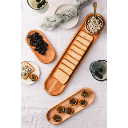 Three cherry appetizer trays with appetizers, blackberries and toasts.