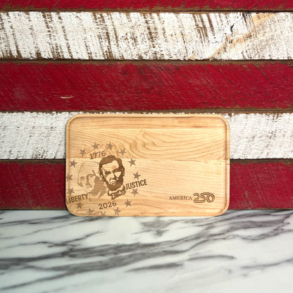 Maple appetizer tray engraved with the image of George Washington and Abraham Lincoln against red and white stripes.