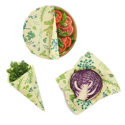 Set of reusable food wraps with vegetable designs on a white background