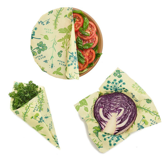 Set of reusable food wraps with vegetable designs on a white background