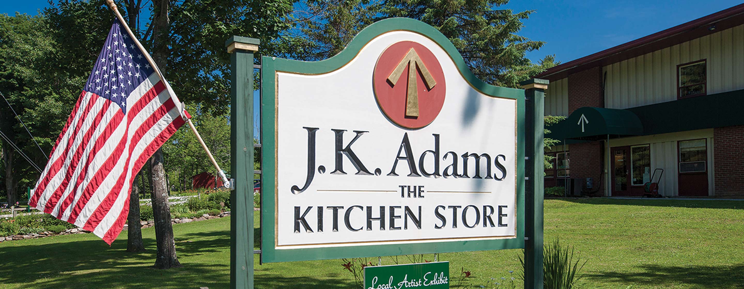 JK Adams sign with American flag.