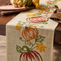 JK Adams embroidered runner with pumpkins on a walnut table.