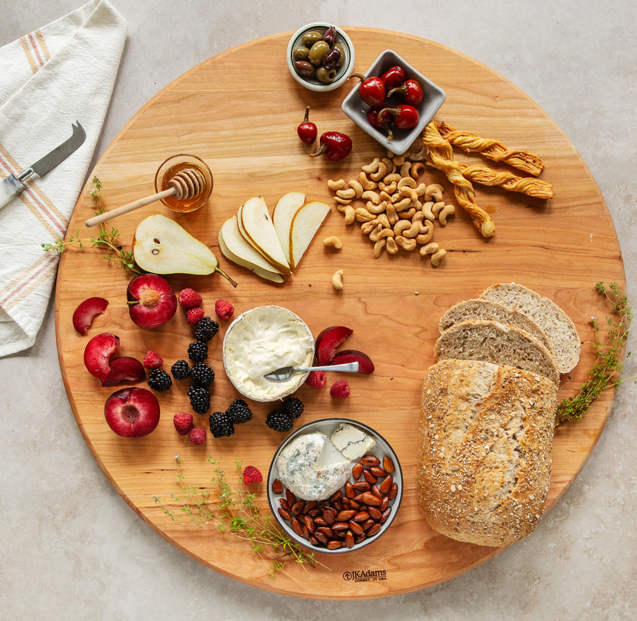JK Adams large cherry cheese board with fruit, cheese, nuts and bread