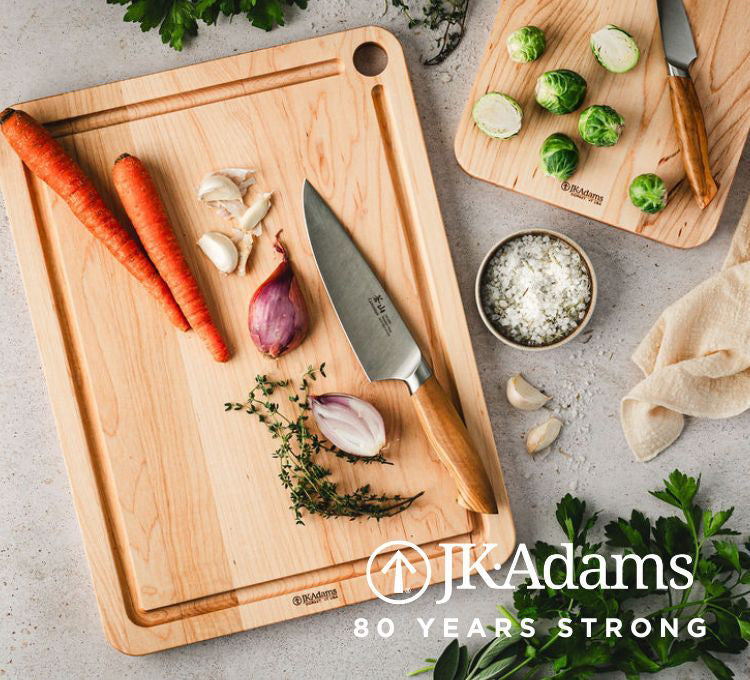 JK Adams Maple prep boards with carrots, shallots, herbs, and brussel sprouts.  "JK Adams.  80 Years Strong."