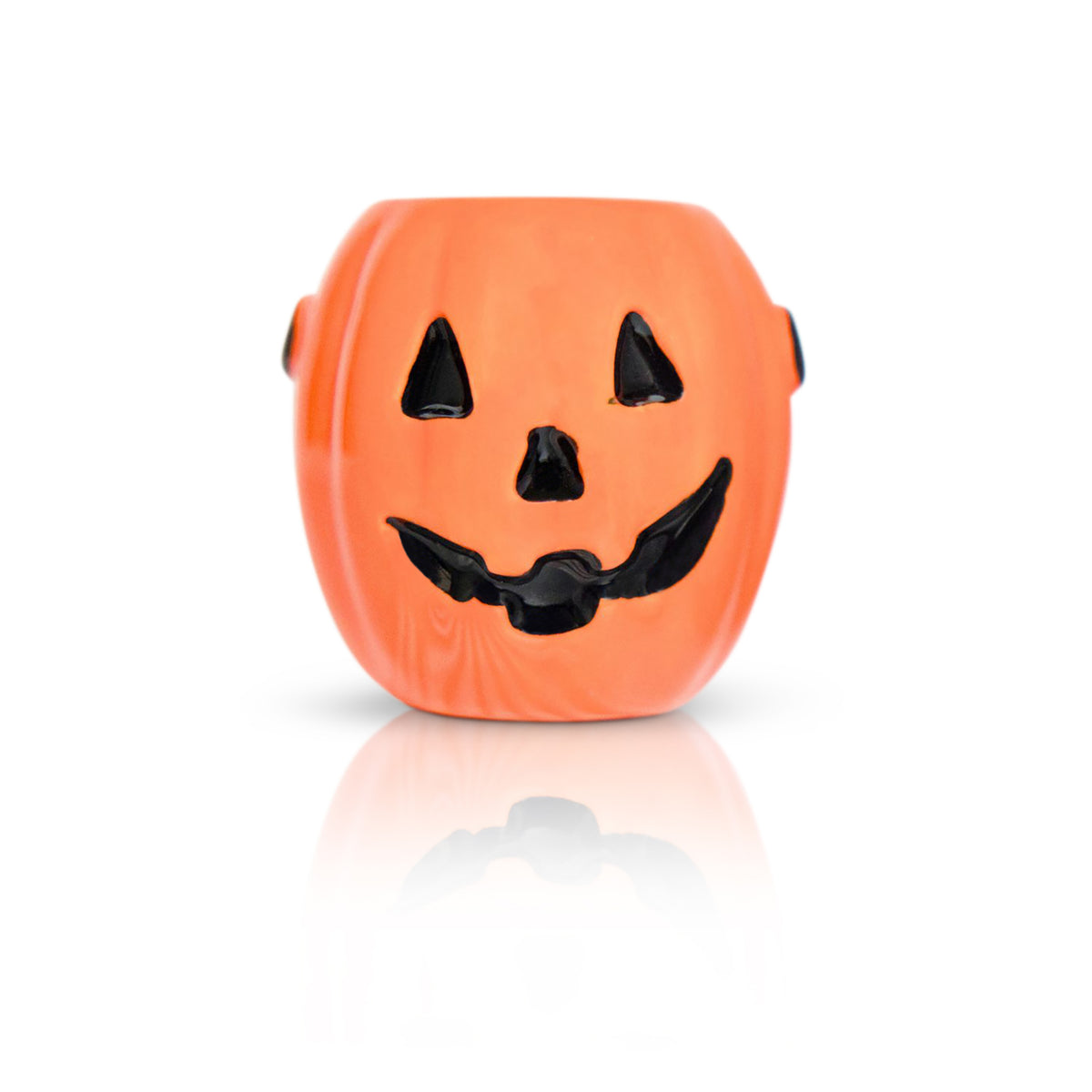 An orange jack-o'-lantern-shaped bead with a black painted face, shown on a clean white background with a soft reflection below.