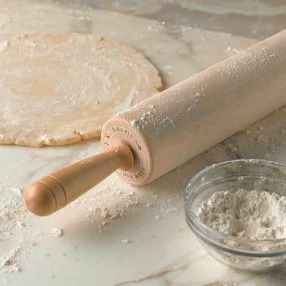 Patisserie Rolling Pin on a board with a dough round and a bowl of flour