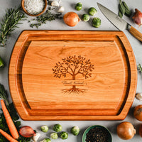 JK Adams Cherry Reversible Carving board with new personalization and veggies on countertop.