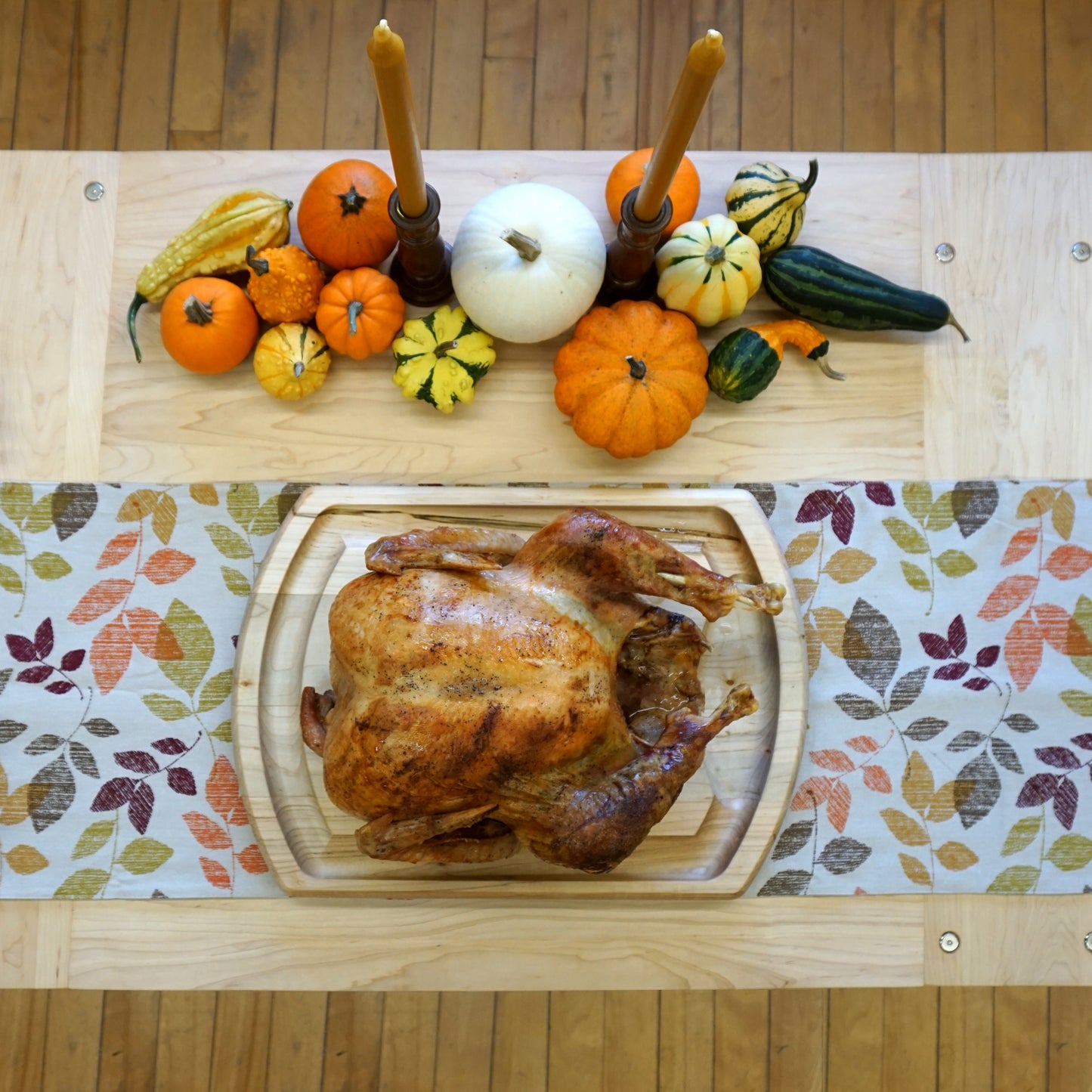 JK-ADAMS-MAPLE-TRADITIONAL-CARVING-BOARD-LIFESTYLE-ROAST-TURKEY-BOARD-ON-MAPLE-TABLE-WITH-CANDLES-AND-PUMPKINS