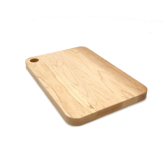 Maple cutting board with a hole in top corner on a white background. 